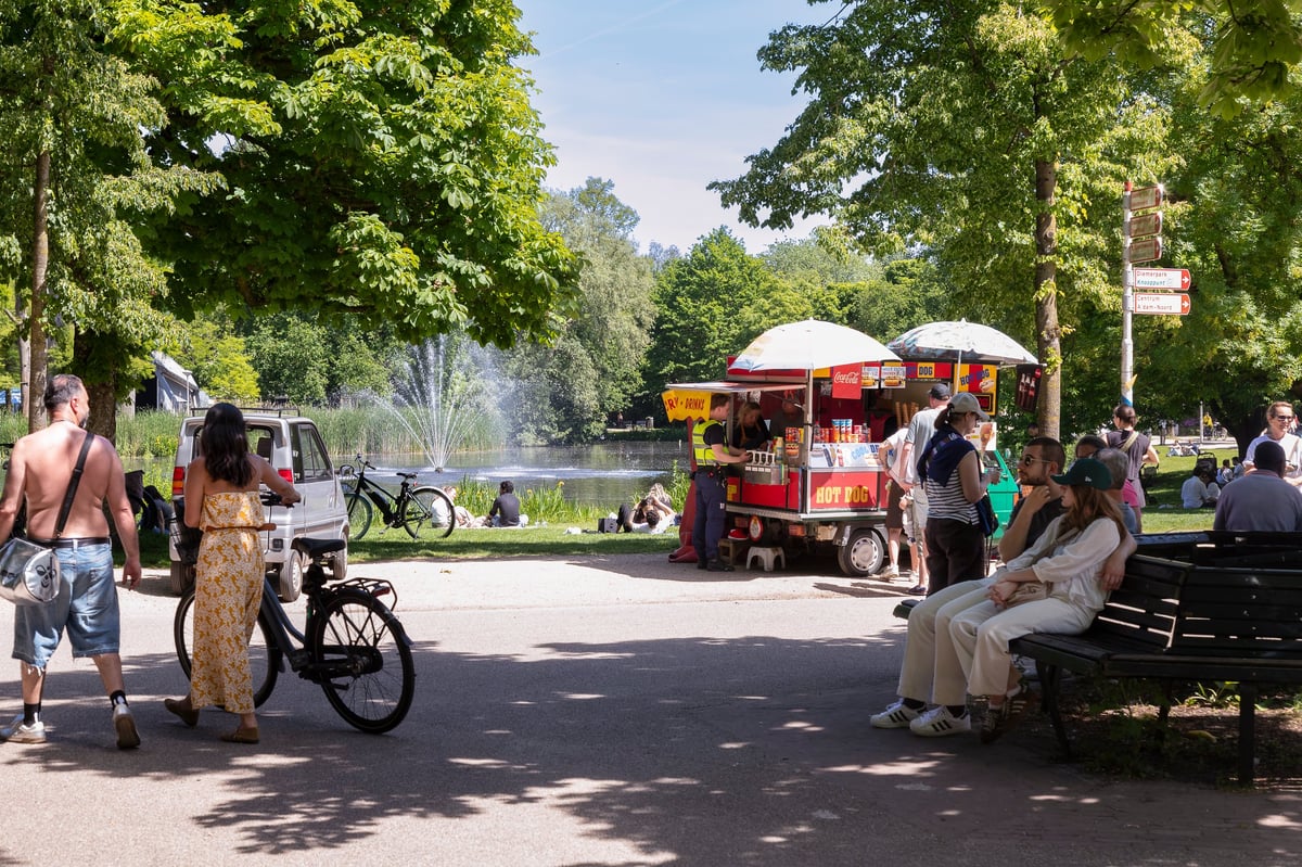People enjoy the Vondelpark in the center of Amsterdam on a sunny day