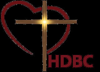 HDBC logo featuring a glowing golden cross with a red heart outline and HDBC text
